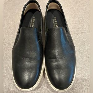 Black slip on shoes with white bottoms